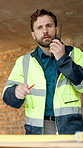 Man, architect and talking with radio on construction site for communication or instructions. Male person, civil engineer or contractor speaking with signal or channel for building safety or security