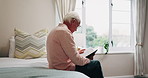 Bible, reading and senior man in bedroom for morning prayer, worship study or Christian faith in home. Praise, religion and elderly person on bed with holy book, gospel or spiritual guide in house