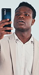 Confused, phone and black man with bad signal in studio for network error, issue or problem. Frustrated, male person or lost connection on mobile smartphone app for poor reception or cellular service