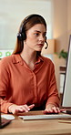 Woman, remote work and headset in home with computer, online script and crm for customer service. Female person, freelancer and typing at house with pc, technical support and information for advisory