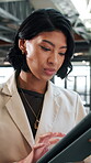 Woman, tablet and reading in office for finance, business venture and info for investment opportunity. Financial manager, tech and scroll in agency for economy research, stock market and trading app