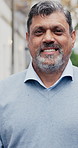 Happy, professional and face of businessman in city with confidence for legal career outdoor. Smile, about us and portrait of mature environmental attorney with pride for sustainable law case.