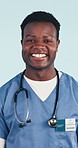 Man, happy and surgeon with face in studio for medical service, cardiology intern or pride. Health, black person or stethoscope on blue background for medicine expertise, career integrity or ambition