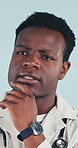 Doctor, thinking and man with decision in studio, contemplating and planning for healthcare service. Blue background, medical professional and black person with health choice, remember and reflection