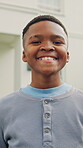Face, pride and smile of black child outdoor for new house success, relocation or weekend break. Development, growth and property with happy boy in front yard of home for moving day or security