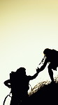 Silhouette, help and men on mountain for hiking, adventure and trekking for tourism on holiday. Hands, space and friends with assistance for travel, climbing and backpacking for hobby in morning