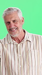 Wellness, face and senior man on green screen with smile, positive attitude or upbeat on weekend. Day off, portrait or elderly person with happy moment, good mood and confidence on studio background.