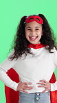 Laugh, face and child with superhero costume in studio for pretend, playing or cosplay for game. Happy, portrait and girl kid with cape and mask for fantasy of fighting crime by green background.