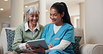 Laughing, tablet and nurse with old woman on sofa in home for consulting, medical app and help. Caregiver, funny and healthcare review with people in living room for healing and online checklist