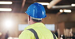 Carpenter, thinking and man with helmet in workshop, decision and planning for furniture production. Artisan, back and mature person with hard hat, flare and project inspection in warehouse and idea