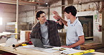 Carpentry, high five and laptop with men in workshop together for production or manufacturing. Computer, conversation and success with happy people in woodworking factory for furniture industry