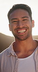 Face, man and smile in nature for travel, adventure and calm morning for summer holiday. Portrait, lens flare and male person outdoor with happiness, positive attitude and fresh air on vacation trip