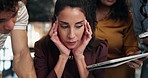 Headache, woman and stress in office with team, overwhelmed and calculator with phone for overwork. Coworkers, migraine and tired person with overload, tablet and deadline pressure with challenge
