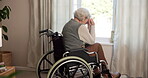 Thinking, regret and old woman at window with wheelchair, worry or reflection of past mistake. Mental health, sad or elderly person in home with disability, emotional thoughts and guilt in retirement