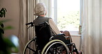Thinking, sad and old woman at window with wheelchair, regret or reflection of past mistake. Mental health, back and elderly person in home with disability, emotional thoughts and guilt in retirement