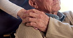 Nurse, elderly and holding hands with shoulder in wheelchair for assisted living or healthcare in house. Woman, caregiver or senior person with a disability for mobility, comfort or nursing aid