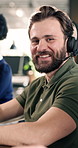Smile, face and man with headset in agency for customer service or online advice in office. Portrait, coworking and happy with agents for virtual assistance, CRM or communication in call center