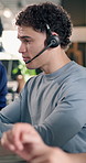 Help, service and man with headset in agency for customer support or online advice in office. Contact us, coworking or agents with chat for virtual assistance, CRM or communication in call center