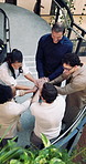 Happy, applause and business people with hands together for team celebration in office building. Top view, excited group or employees piling with stack for solidarity, unity or mission in workplace