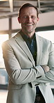 Face, smile and businessman with arms crossed in company, insurance executive and experience. Corporate professional, confidence or happy mature person in office, claims manager or about us in USA