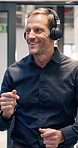 Happy, headphones and businessman dancing in office for vibe, fun energy or celebration. Excited, male person or employee with smile or listening to music or app for audio streaming in workplace