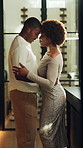 Dancing, love and African couple in home for bonding, connection and romantic moment on weekend. Marriage, happy and man with woman with music, movement and affection for relationship in kitchen
