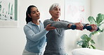 Physiotherapist, help and old woman in clinic with dumbbells, strength exercise and rehabilitation. Senior person, healthcare worker and support with workout, weights and fitness for joint mobility.
