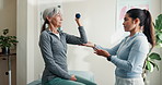 Physiotherapist, advice and old woman in office with dumbbells, strength exercise or rehabilitation. Senior person, healthcare worker and support with workout, weights and fitness for joint mobility.