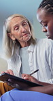 Nurse, old woman and writing on clipboard for healthcare, wellness survey and consultation in home. Checklist, caregiver and person in retirement with medical report, talking and notes for checkup
