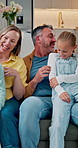 Playing, parents and children with tickle in home for bonding, laughing and security on weekend. Love, people and kids with funny game on sofa for family connection, relationship development or happy