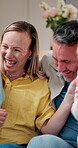 Playing, parents and children with laugh in home for tickle, funny bonding and support on holiday. Love, people and playful with kids in house for family connection, relationship development or happy