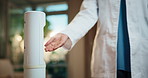 Dispenser, hands and doctor with sanitizer in hospital for hygiene, disinfection and germ prevention. Healthcare, clinic and person with spray for bacteria, virus protection and wellness for health