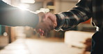 Handshake, men and carpenters in workshop with agreement, deal or partnership on industry project. Meeting, flare and woodworker shaking hands with client for furniture manufacturing in factory.