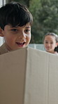 Children, box and family moving in with suitcase for new home, relocation or shelter together. Mom, dad and luggage with daughter, son or kids running in house for real estate, security or safety
