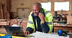Laptop, man or smile with phone call in carpentry for shopfitting project, custom design or approval. Blueprint, mature black person or contact in warehouse for cabinetry layout, tech or construction