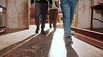 Carpentry, legs or people in factory with inspection, safety check or quality control in timber warehouse. Maintenance, team or artisan with walk, operation track or evaluation in woodwork compliance