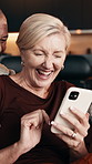 Mature, couple and laugh in house with phone, funny social media video and bonding together on weekend. Happy, interracial marriage and people in home with tech, discussion and humor for online meme.
