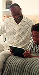 Boy, tablet and travel with father in bedroom of home for bonding, connection or gaming. App, gamer son and holiday with dad on bed in apartment for development or subscription as black family