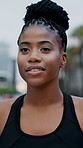 Breathe, smile and black woman in city for running exercise, outdoor workout or training for cardio fitness. Tired runner, thinking or sports person with fatigue, rest and relax on break in New York