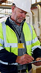 Mature, man and inspector clipboard in workshop for engineering, construction and inspection. Writing, building site and person at work for productivity, supervision and checklist for compliance