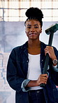 Construction, face or black woman on site with hammer, contractor or pride in demolition. Confidence, flare or happy engineer on worksite with wink, wrecking worker or about us in industrial industry