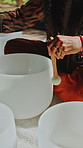 Meditation, hands and woman with singing bowls for sound therapy, wellness and holistic healing. Naturopathy, zen and person with frequency, vibration and instrument for balance, calm and mindfulness