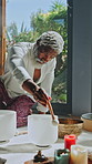 Meditation, singing bowls and mature man for sound therapy, wellness and balance. Naturopathy, zen and African person with frequency, vibration and session for natural healing, calm and mindfulness