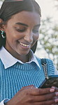 Business, typing and happy woman with phone in city for online chatting, texting or social media. Female person, employee or conversation with smile on smartphone for communication or app in town