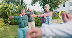 Stretching, trainer and senior people in garden for wellness, exercise and mobility movement for arthritis. Outdoor, instructor and elderly group for strength, health and fitness at nursing home