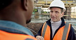 Building, teamwork and talking with men on construction site for meeting or planning. Collaboration, conversation and engineering  with architect people on worksite together for project management