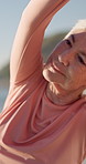 Yoga, beach and senior woman with stretching, exercise or wellness routine in morning on holiday. Health, outdoor and elderly person by ocean for fitness, active and pilates by seaside on weekend.