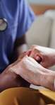 People, nurse and holding hands with senior patient for understanding, healthcare or empathy. Closeup, caregiver or doctor with sympathy for elderly care, discussion or comfort in nursing home