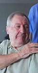 Old man, comfort and holding hands with nurse in nursing home, help or connection healthcare worker. Caregiver, chat and bonding with senior person, homecare and support for patient and elderly care