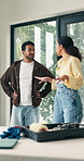 Thinking, couple and talking at house for renovation, planning and interior design for makeover. People, discussion and inspiration in living room for decor, diy remodeling and household improvement 
